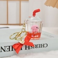 Octopus milk tea bottle keychain with red liquid, glitter and heart charm pendant - Red Octopus