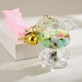 Pink bear milk tea cup keychain with liquid glitter, golden bell and silicone strap - Glowing Bear Style / Green