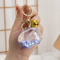 Porte-clés ours polaire créatif avec liquide bleu et fermoir mousqueton doré brillant - Télévision