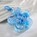 Blue acrylic oil-filled floral keychain with floating blue and white blossom petals - Sapphire Blue