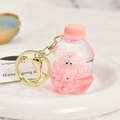 Detail of pink Capybara liquid drifting bottle keychain with glitter and cute character - Soda Bottle (Pink Rabbit)