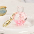 Portachiavi a cuore con liquido rosa, statuetta di coniglio e petali di ciliegio - Bottiglia di Profumo (Coniglio Rosa)