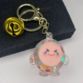 Detail of cartoon glitter quicksand keychain with pink smiley face and gold bell - Light Gold Clasp+Bell+Eggy(654856) / Sparkling White