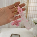 Pink starfish liquid keychain with sequins in a flower acrylic case and wrist strap - Pink Starfish
