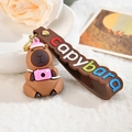 Adorable Capybara keychain with pink camera charm and colorful silicone wrist strap - Letter Strap And Capy / Photography