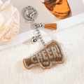 Llavero de megáfono con diamantes de imitación, letras CHEER y borla de ante suave - Amarillo Jengibre
