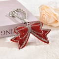 Detailed view of red rhinestone bow keychain with velvet finish and crystal hand strap - Red with Rhinestone Rope and Small Ring