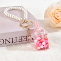 Detalle de llavero de taza de té con leche con perlas blancas y purpurina líquida flow - Llavero + Taza de Té de Leche Pequeña / Rosa Rojo