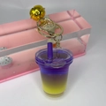 Close-up of creative liquid sand milk tea cup keychain with purple gradient and gold bell - Light Gold Buckle + Bell + Oil-filled Milk Tea Cup / Deep purple