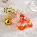 Star-shaped orange flowing sand keychain with cute red dragon and golden bell - Orange Dragon Oil Bottle [Star Shape]