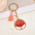 Portachiavi albero della vita dorato con nappa rosa e ciondolo boho di perline rosse - Rosso
