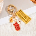 Goldener Abakus Schlüsselanhänger mit Kaninchen-Anhänger und Glücksbringern für Taschen - Friedensanhänger