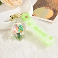 Creative conch keychain with green rabbit toy and star silicone strap on soft white fur - Green Dinosaur