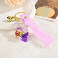 Creative rabbit keychain with purple liquid gradient shell and gold bell on a soft background - Purple Little Turtle