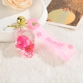 Pink octopus ice cream keychain with glitter liquid pendant and golden bell accessory - Pink Octopus