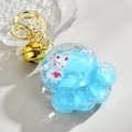 Cat paw liquid keychain with white bunny doll inside blue floating glitter oil - Blue Bear Paw