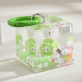Macro detail of acrylic cube keychain with white cartoon doll and green car inside - Color Ring Square Bottle Style / Green
