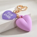 Cute heart keychain with purple FOR EVER pendant and matte 3D charm on stone background - Purple