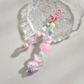 Dettaglio di perline a farfalla in acrilico colorato e ciondoli a fiore con moschettone - Fibbia a D + Catena di Perline / Rosa