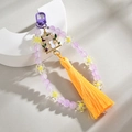 Detail of handmade beaded charm with purple beads, cat pendant and long yellow silk tassel - Purple