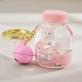 Pink liquid quicksand keychain featuring a white cat in a racing car with a gold ring - Bottle Decor / Pink