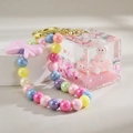 Pink liquid quicksand keychain with white rabbit in a car and colorful beads - Chain Style / Pink