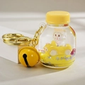 Cute liquid quicksand keychain featuring a white cartoon sheep in a yellow car with bell - Bottle Decor / Lemon Yellow