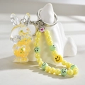 Detail of yellow rabbit oil keychain with glitter stars and colorful smiley face beads - Lemon Yellow (Rabbit Chain)