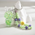 Close-up of green luminous rabbit keychain with glitter stars and beaded smiley chain - Green (Rabbit Chain)