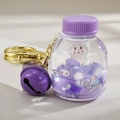 Cute purple liquid quicksand bottle keychain featuring a cartoon doll and purple bell - Bottle Decor / Purple