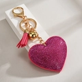 Pink rhinestone heart keychain with leather tassel and gold bell on display stand - Rose Red