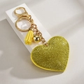 Detail of yellow heart leather keychain with rhinestones, gold tassel, and lobster clasp - Lemon Yellow