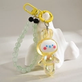 Detail of yellow rabbit pendant with bead strap and metallic hook on white background - Keychain + Dancing Rabbit / Lemon Yellow Chain Style