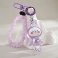 Close-up of a purple iridescent bunny charm with matte beaded wrist strap and lobster clasp - Keychain + Dancing Rabbit / Purple Chain Style