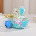 Blue rabbit liquid quicksand keychain with colorful beads and a golden ring - Blue Rabbit Head