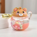 Cute brown bear keychain with pink oil liquid and macaron beads in transparent globe - Pink Lucky Bear