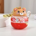 Brown bear liquid quicksand keychain with red liquid and colorful beads inside - Red Lucky Bear