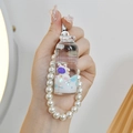 Floating milk bottle keychain with astronaut rabbit, liquid glitter and pearl beads - Milk Bottle Astronaut