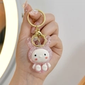 Cute pink glowing bunny keychain made of glitter resin with gold lobster clasp - Pink