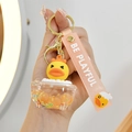 Porte-clés canard lumineux avec bouteille de sable mouvant et dragonne en silicone rose - Baignoire Orange