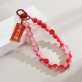 Close-up of red beaded keychain featuring a gold engraved tag with Chinese blessings - Bright Future (Red Beads Style)