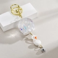 Porte-clés carillon cygne créatif avec anneau doré et paillettes colorées à l'huile - Blanc
