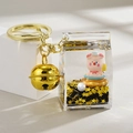 Porte-clés cochon rose à sable mouvant liquide en brique de lait avec cloche dorée - Style Cloche Brique de Lait