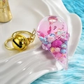 Portachiavi luminoso a forma di gelato rosa con perline galleggianti e campanello d'oro - Viola