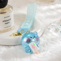 Macro detail of iridescent blue bear keychain with strawberry popsicle and silicone strap - Bear strap + Luminous Bear / Blue