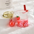 Acrylic strawberry liquid glitter keychain with floating charms and gold key ring - Red