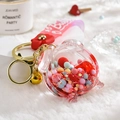 Acrylic liquid shaker keychain with cute pig design and pink silicone wristlet strap - Alarm Clock Red