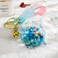Astronaut acrylic liquid keychain with colorful beads and blue-pink silicone strap - Alarm Clock Blue