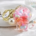 Creative pink astronaut acrylic keychain with liquid sand and pearl charm - Astronaut Pearl Pink