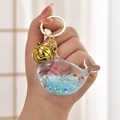 Glow-in-the-dark whale oil bottle keychain with blue liquid and gold hardware - Light Gold Buckle + Luminous Fish + Bell / Luminous Blue
